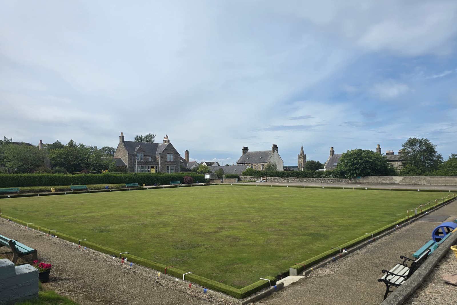 The bowling green at Cullen Bowling Club with the town behind